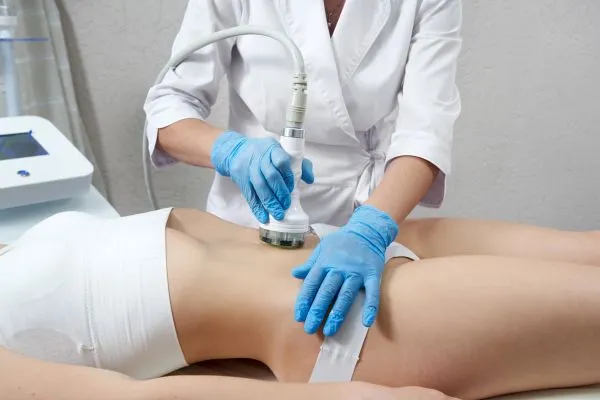 woman having HIFU treatment on her stomach to combat loose skin Busby following weight loss